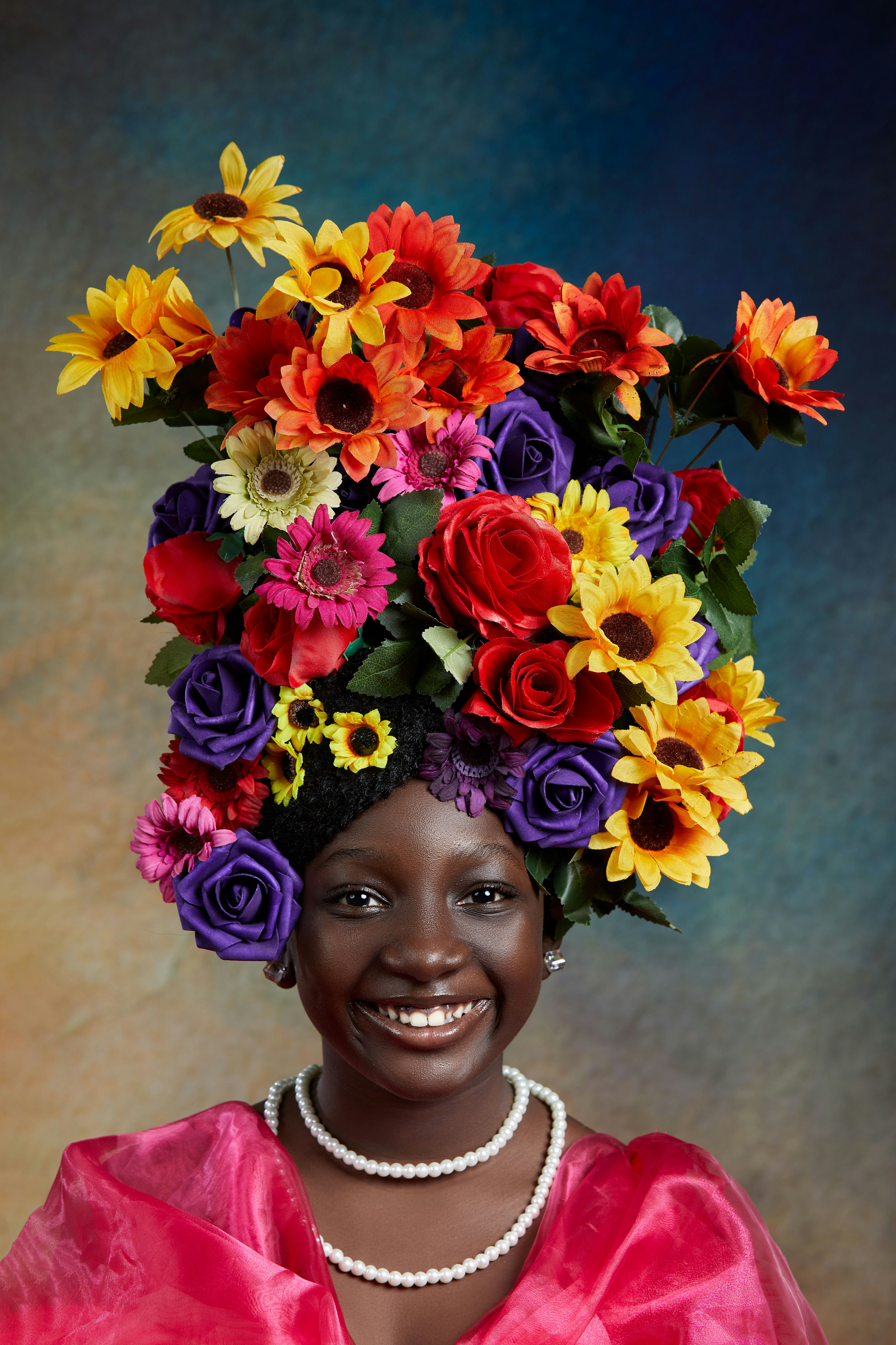 woman with red yellow and blue flower crown